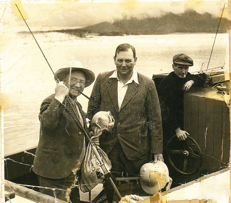 The Scottish Music-Hall Singer/Comedian Sir Harry Lauder (L) with Clive Firth (C) and Jock Dinse (R) abord the "EDITH" at Bermagui, 1938 Photo Mrs Sylvia Dinse